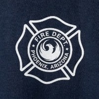 Phoenix Fire Department custom shirt logo printed on navy apparel by Phoenix Custom Tees.